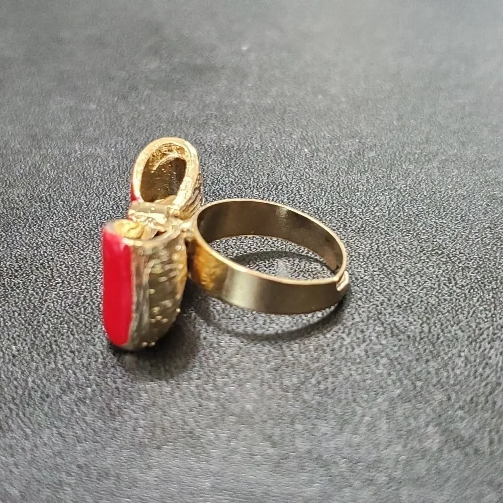 Gold tone red enamel bow ring currently a 7